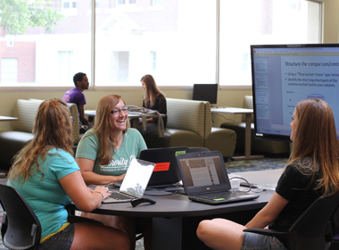 Students working around a table